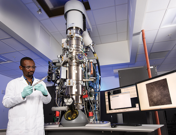 Male student in High Bay research facility conducting atomic-scale Imaging