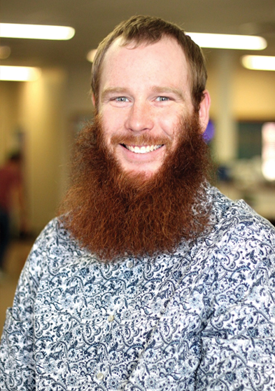 Man with beard in a patterned shirt