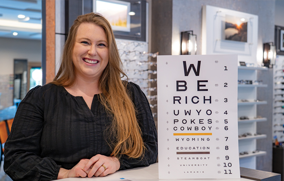 person in a black shirt in an eye doctors office