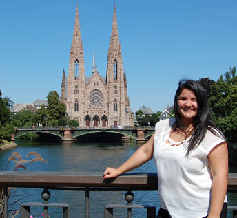 woman standing with large cathedral in the background