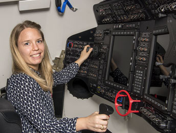 woman at a large control panel