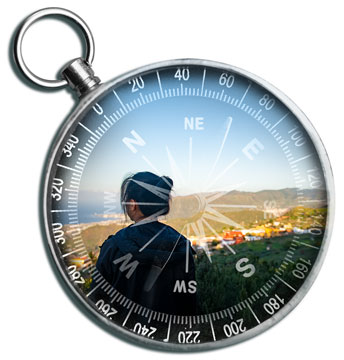 compass with a picture of a person superimposed on it