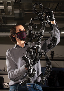 person holding a metal exoskeleton