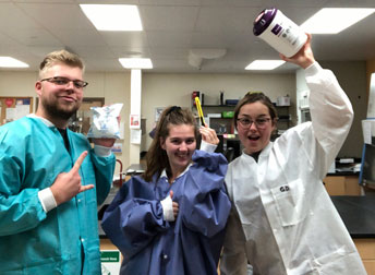 three people in lab coats