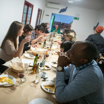 Faculty and Students eating dinner while abroad