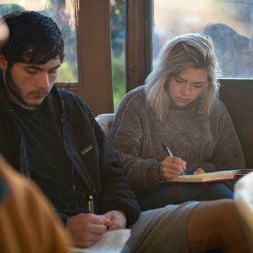 Students taking notes in class while abroad