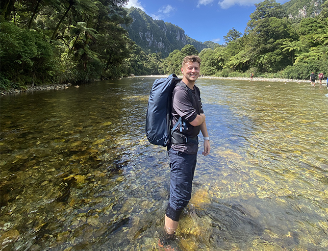 Mason Baum tramping through westland Tai Poutini National Park, New Zealand