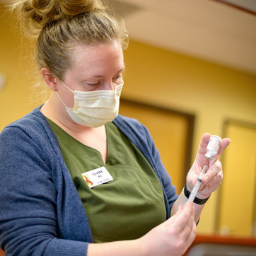 Vaccine being administered by a Registered Nurse