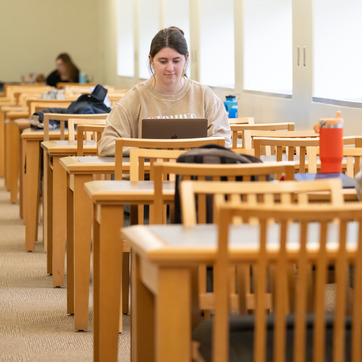 Student studying in Coe Library