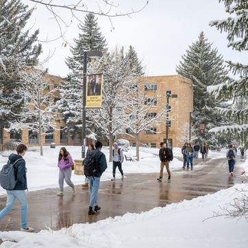 Students walking on campus in the snow