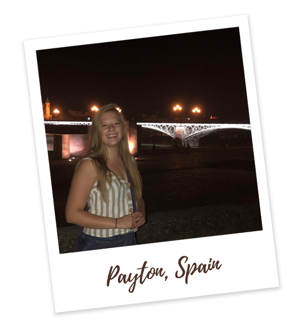 Payton in Spain in front of bridge