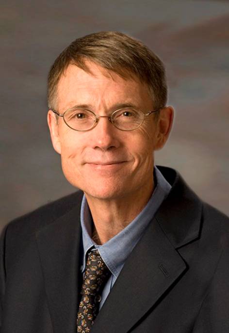 man in a suit, wearing glasses