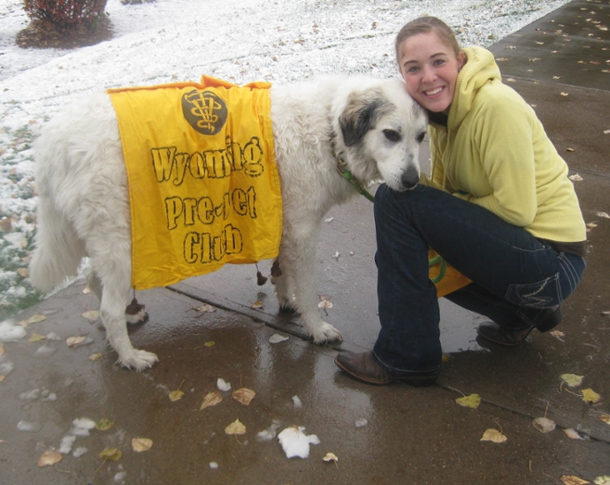 student and dog in homecoming parade