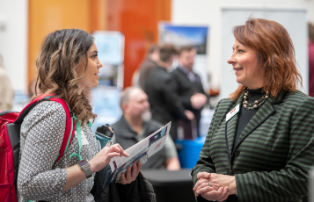 Student talking to potential boss at career fair