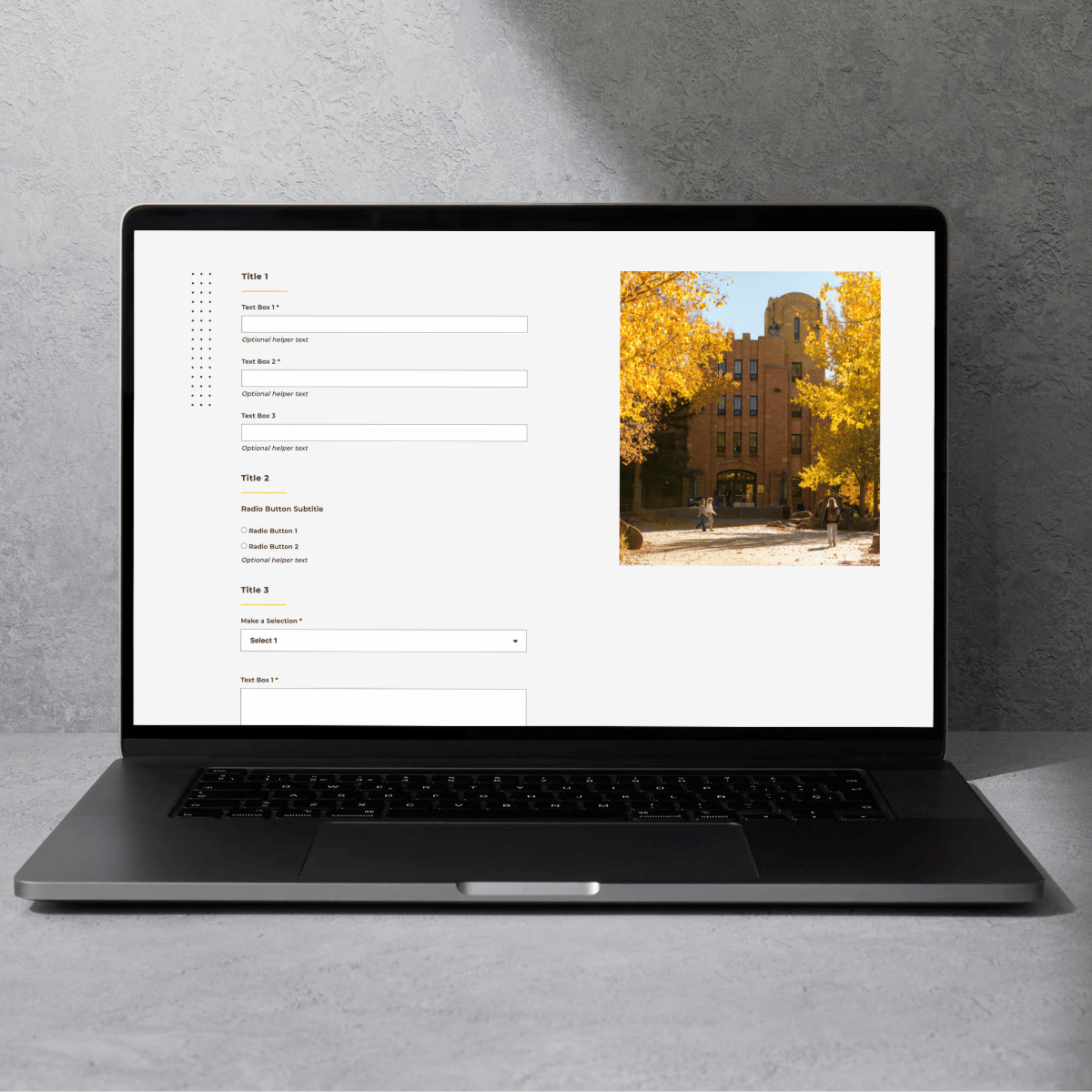 A photo of a computer with a proof of UW's form page template.