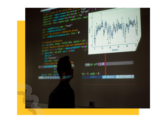 code on screen with a person's shadow