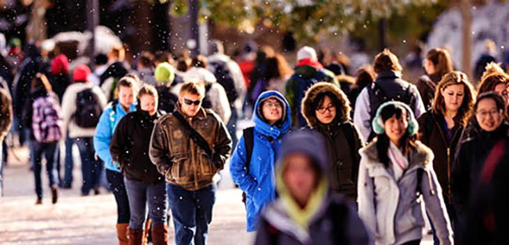 students walking on campus during winter