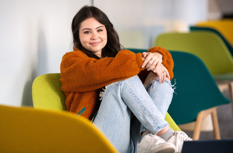 A student sits in a chair
