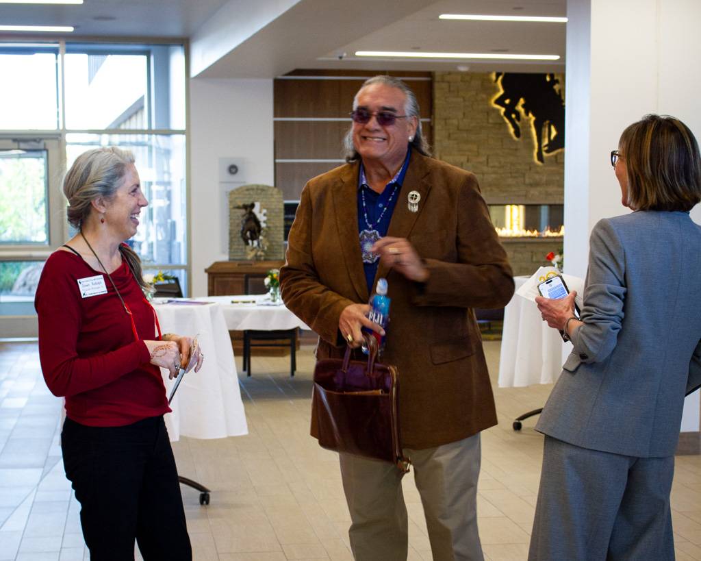 Jim Warne laughing with Dawn Rudolph and Interim Executive Director, Michelle Jarman.