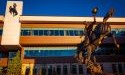 The UWyo Gateway Center with a bronze bucking horse statue in the foreground.