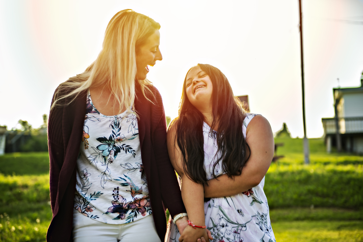 two women walking outdoors