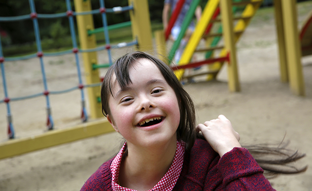 child with down syndrome at playground