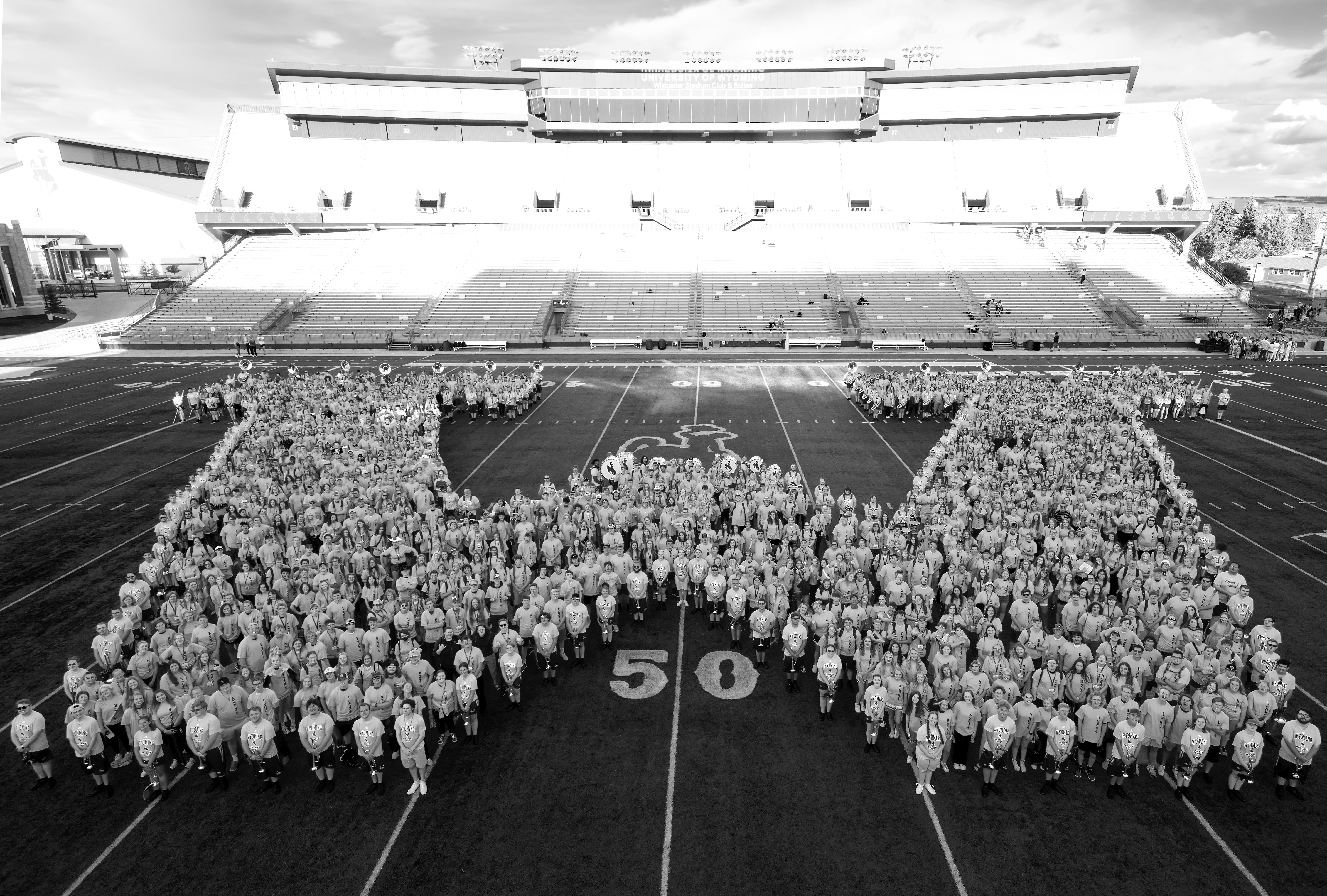 University of Wyoming Students forming a W on the football field