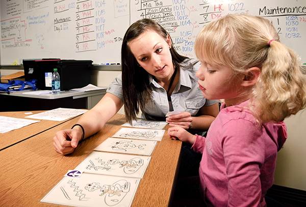 woman working with a child