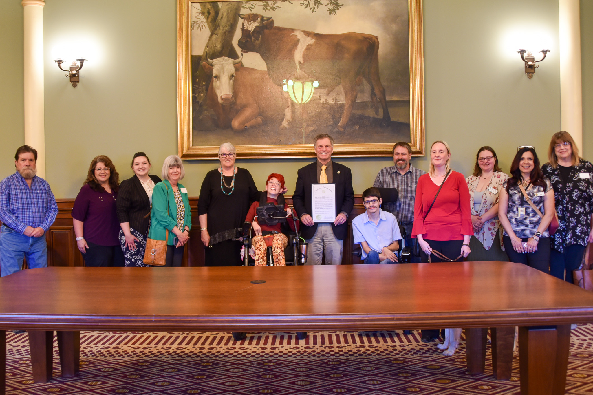May 2024 Wyoming Assistive Technology Awareness Month Proclamation Signing with Gov Mark Gordon, AT Advisory Council, and WATR faculty and staff. 