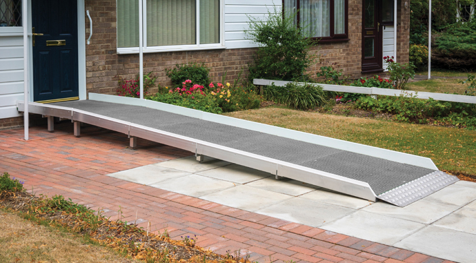 temporary wheelchair ramp leading into a house