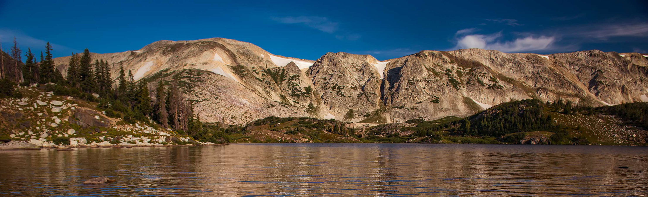 snowy range mountains and lake