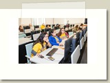 three participants in cowgirl t-shirts in computer lab