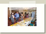 woman, man and girl talking at registration table