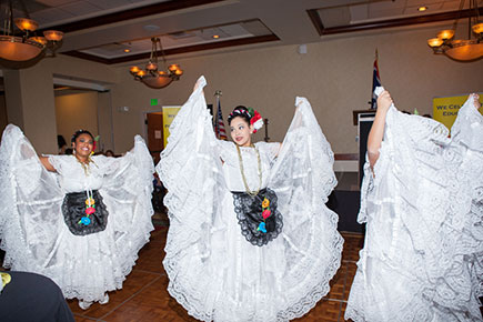 three dancers in white dresses