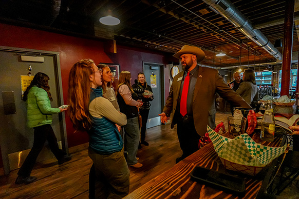 Wyoming Office of Tourism Executive Director Domenic Bravo Speaks with Taylor Kruger, asssistant research scientist for the Jay Kemmerer WORTH Institute, at Bond's Brewing in Laramie, Wyoming, Feb. 12, 2026.