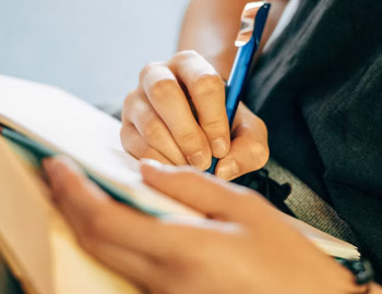 writing in notebook