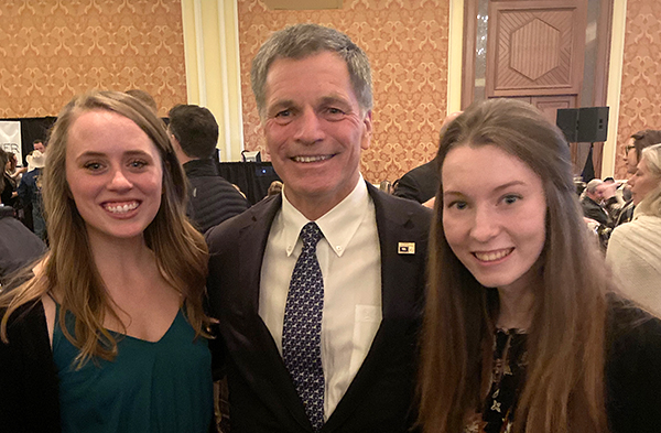 Students posing with Mark Gordon