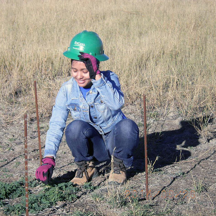 Female student studying selenium remediation