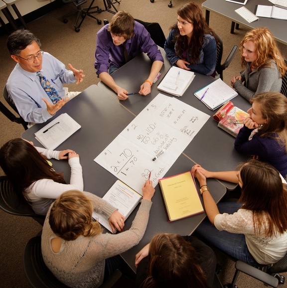 Photo of UW College of Education professor working with future teachers.