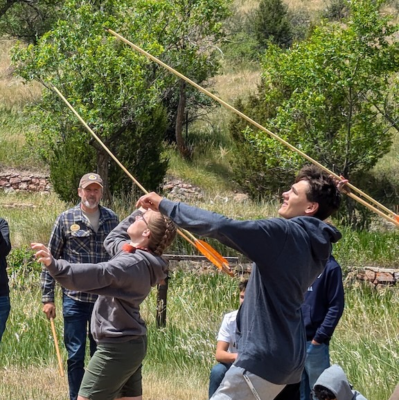 Photo of High Altitude Pathways summer attendees throwing atlatls at the HAP Summer Institute.