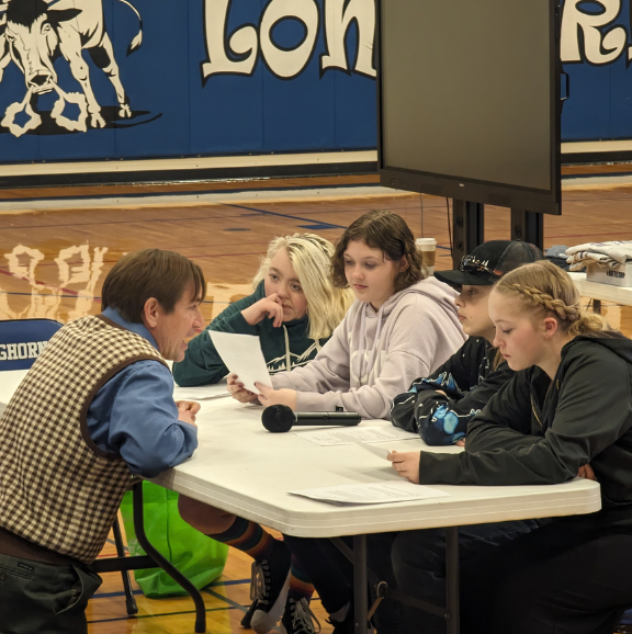 Photo of UWyo Faculty engaging with high school students.