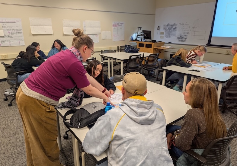 Photo of Dr. Anne Aydinian-Perry working with future education students.