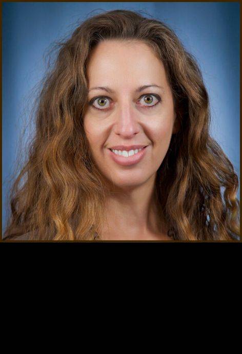 Dr. Tracie Caller, wearing a grey shirt.