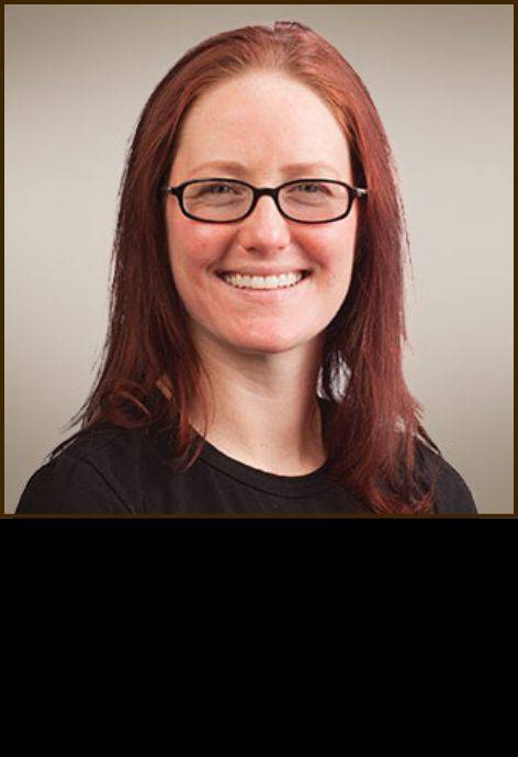 Dr. Amy Tortorich, wearing a black blouse.