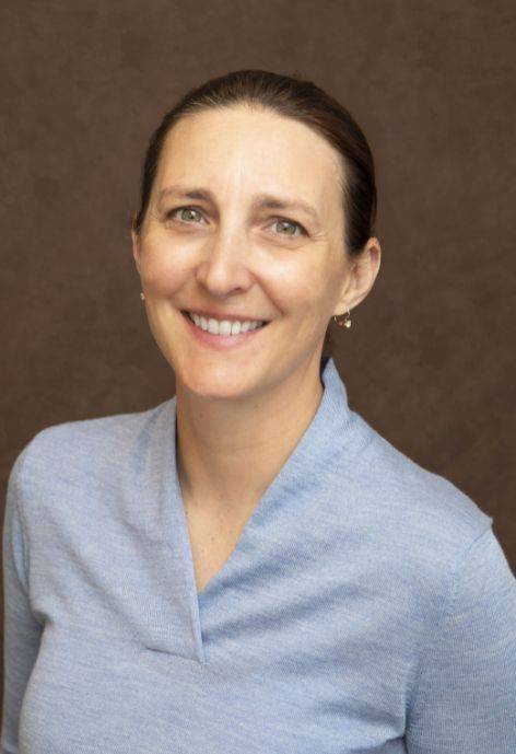 Amy Navratil, wearing a light blue sweater.