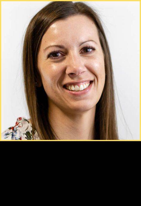 Dr. Samantha Herriott, wearing a floral blouse.
