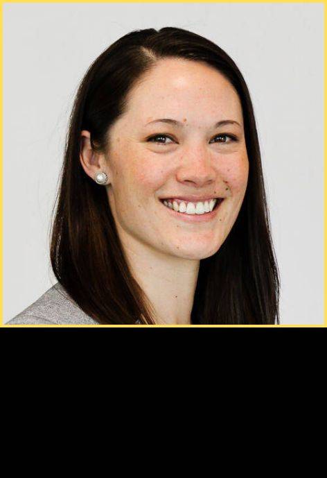 Dr. Kim Westbrook, wearing a light grey sweater.