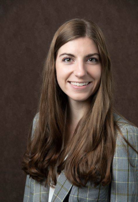 Hannah Mills wearing a plaid jacket and a white blouse.