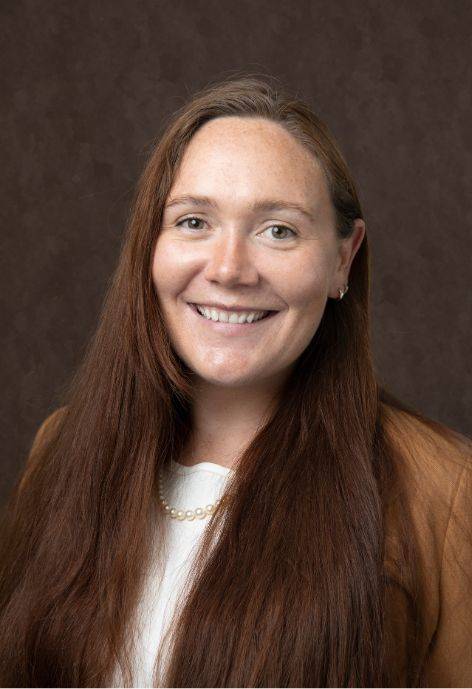Heidi Taggart wearing a light tan jacket and a white blouse.