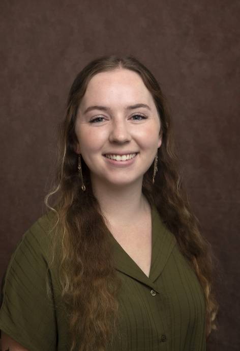 Chantelle Barr, wearing a forest green blouse.